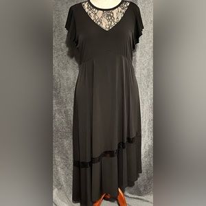 Torrid, new with tags. Black midi asymmetrical dress with beautiful lace detail